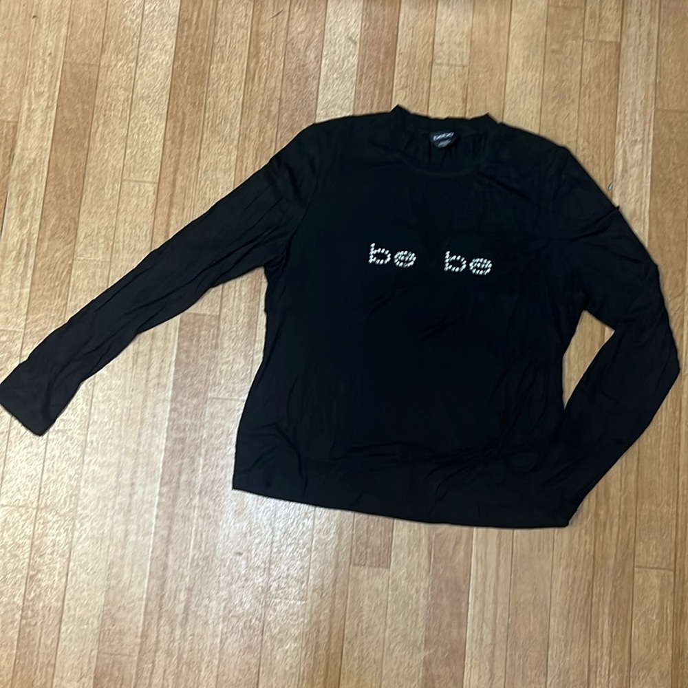 Women Bebe long sleeve with v neck with mesh insert and bejeweled front size XL